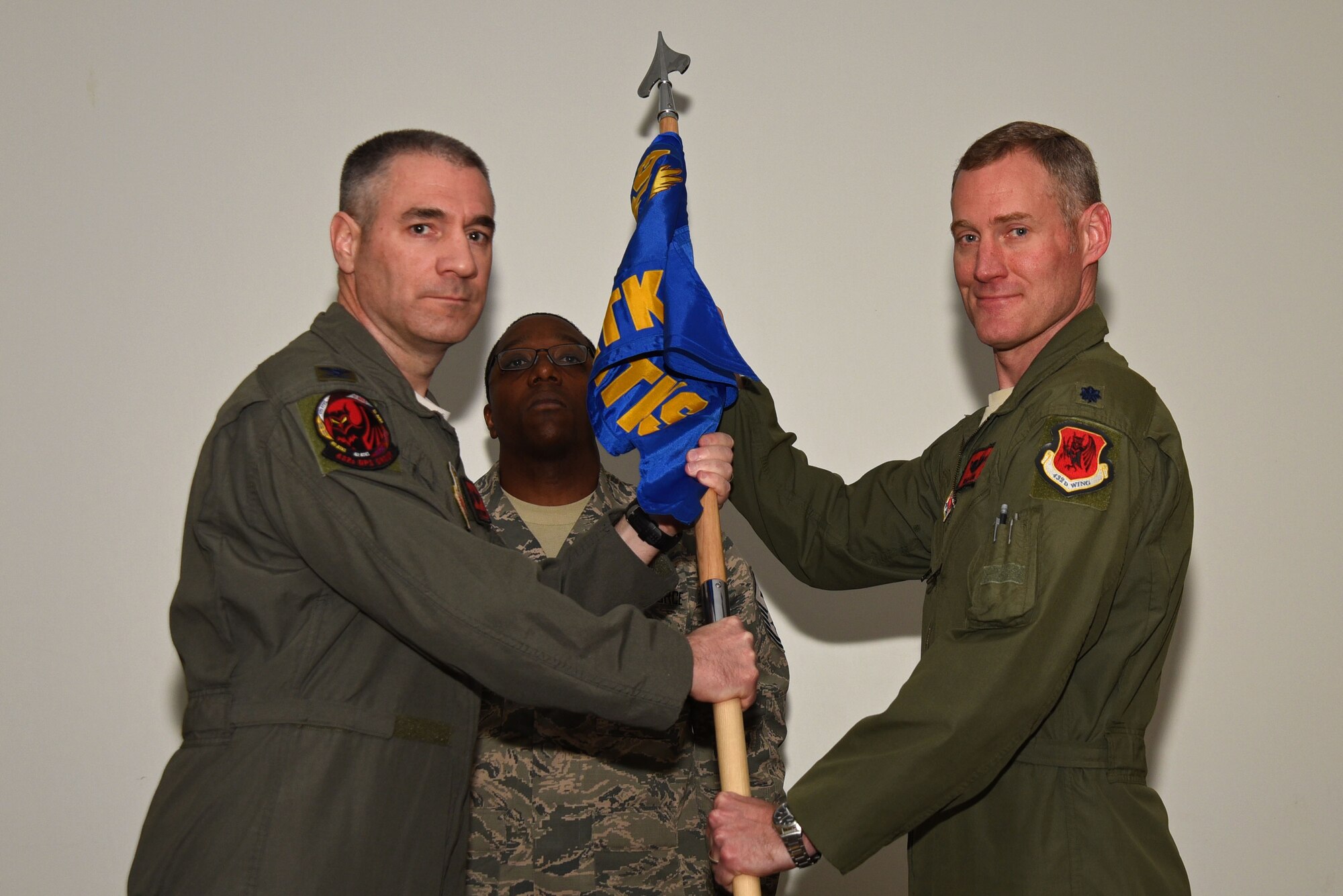 U.S. Air Force Col. Joseph, 432nd Operations Group (OG) commander, left, appoints Lt. Col. David, former 432nd OG Det. 1 commander, as commander of the 50th Attack Squadron following the squadron’s activation at Shaw Air Force Base, S.C., Feb. 27, 2018.