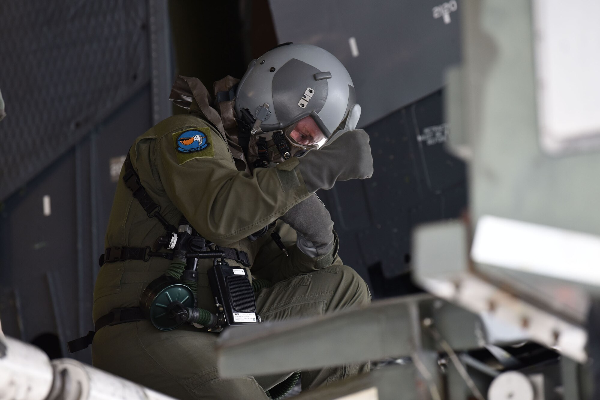 Technical Sgt. Justin Leonard, a 9th Airlift Squadron loadmaster, directs a K-loader to the cargo bay of a C-5M Super Galaxy during the 2018 Exercise Vengeant Eagle Feb. 22, 2018. The exercise showed the importance of base wide professional readiness in all career fields. (U.S. Air Force photo by Airman 1st Class Zoe M. Wockenfuss)