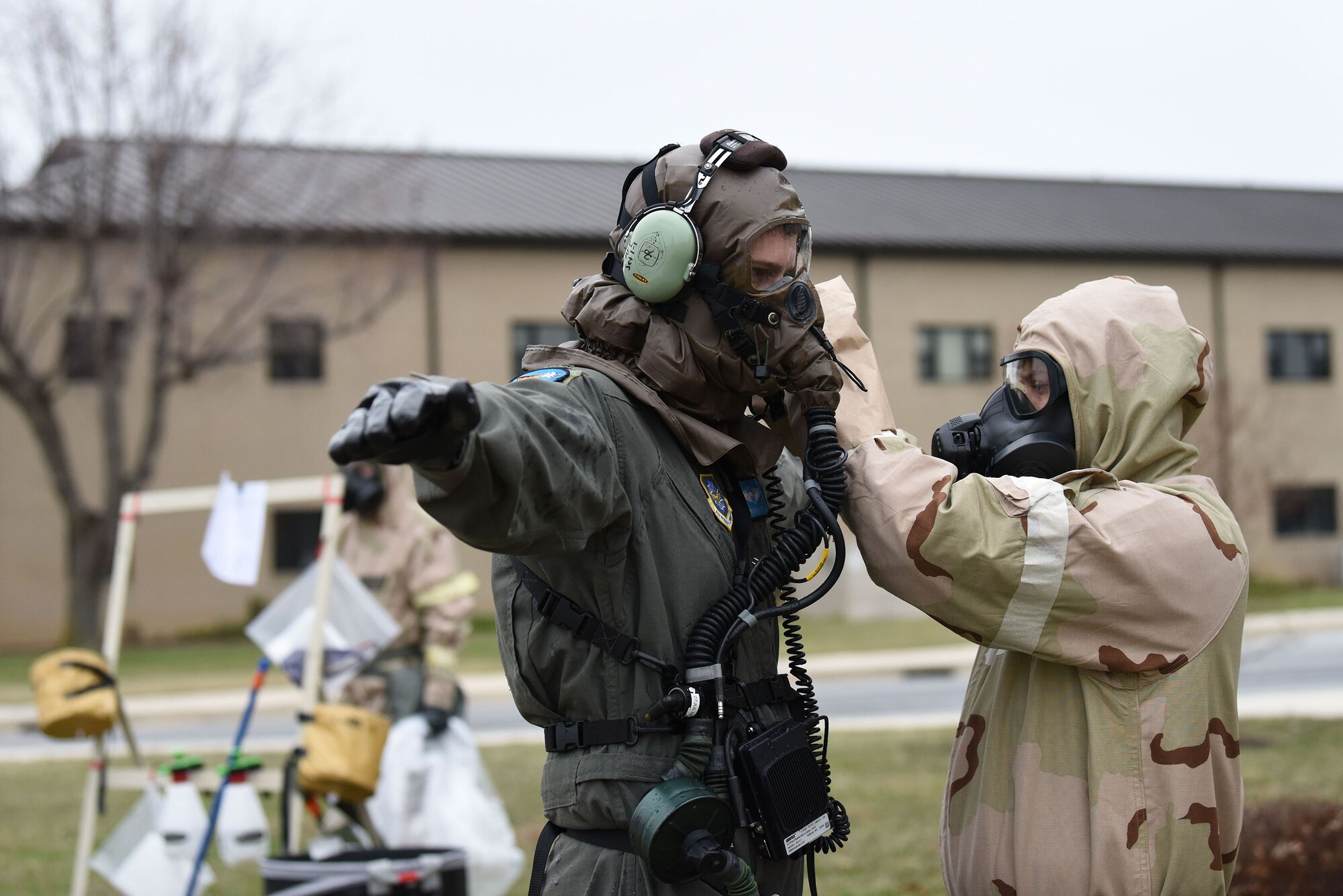 Maj. Andrew Snow, with the 9th Airlift Squadron, goes through simulated decontamination during the 2018 Exercise Vengeant Eagle Feb. 22, 2018. Aircrew flight equipment technicians practice Aircrew Contamination Control Area processes and procedures. (U.S. Air Force photo by Airman 1st Class Zoe M. Wockenfuss)