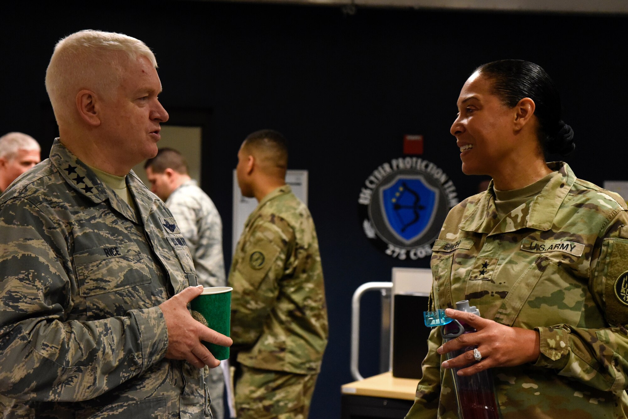 Air Force Lt. Gen. L. Scott Rice, the Director of the Air National Guard, speaks with Army Maj. Gen. Linda L. Singh, Maryland adjutant general, February 10, 2018 while touring Warfield Air National Guard Base, Middle River, Md.