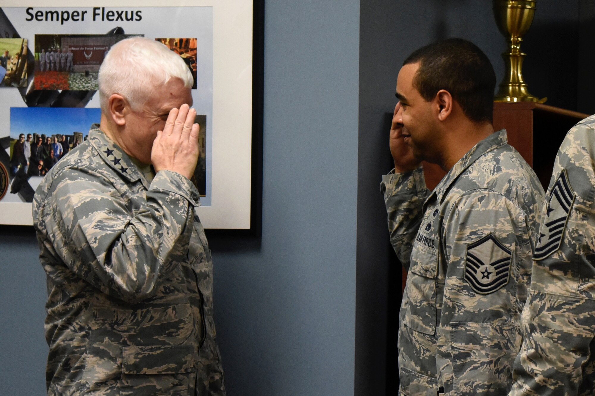 Lt. Gen. L. Scott Rice, the Director of the Air National Guard, Master Sgt. Dallas Perry, 235th Civil Engineering Flight program analyst, salutes Lt. Gen. L. Scott Rice, the Director of the Air National Guard, after being coined February 10, 2018 at Warfield Air National Guard Base, Middle River, Md.