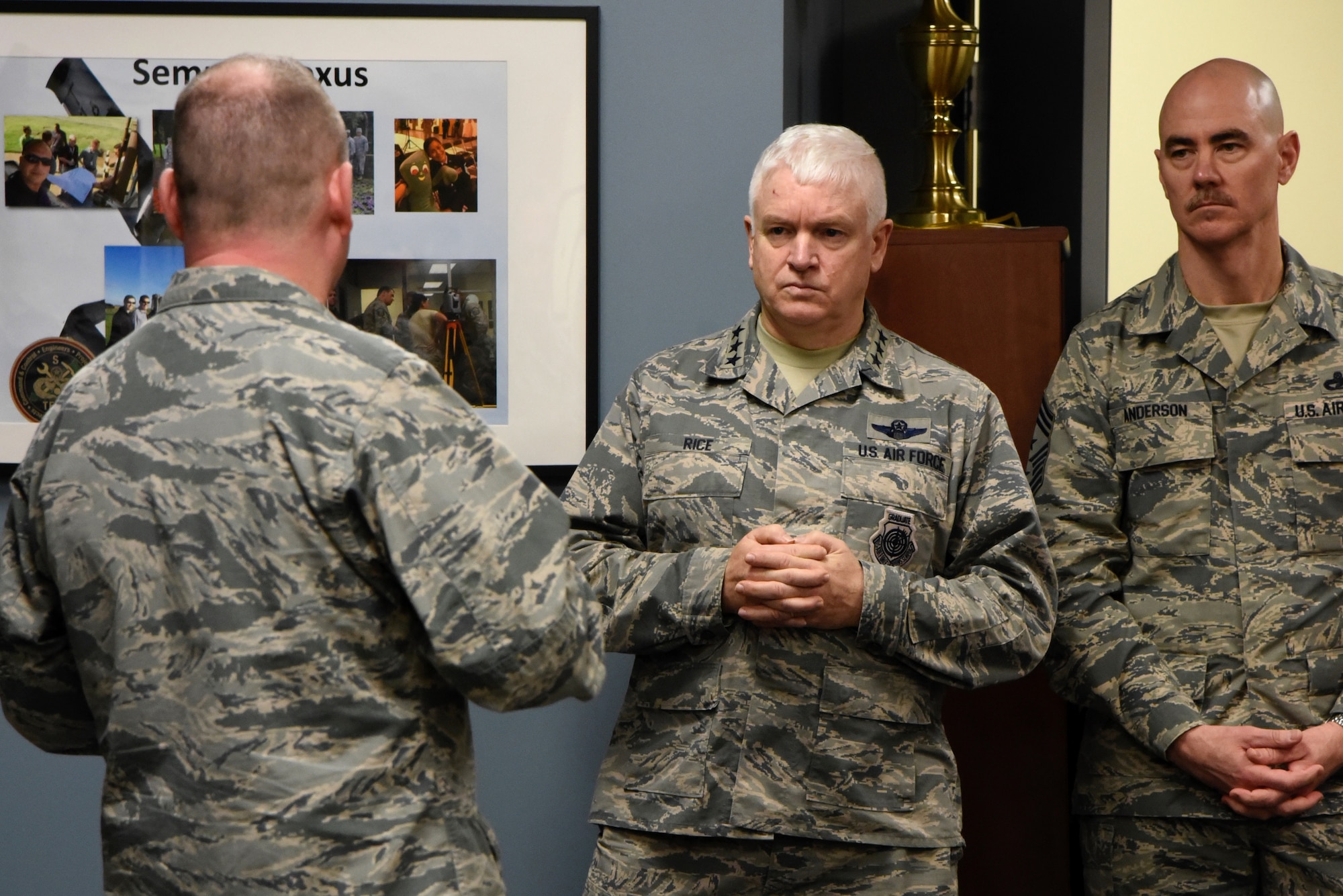 Lt. Gen. L. Scott Rice, the Director of the Air National Guard, and Command Chief Master Sgt. Ronald C. Anderson Jr., Command Chief Master Sergeant of the Air National Guard, listen to a question from a 235th Civil Engineering Flight member, February 10, 2018 while touring Warfield Air National Guard Base, Middle River, Md.