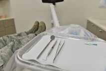 Tools are placed on a tray to prepare for a dental exam at Joint Base Langley-Eustis, Virginia., Jan. 30, 2018.