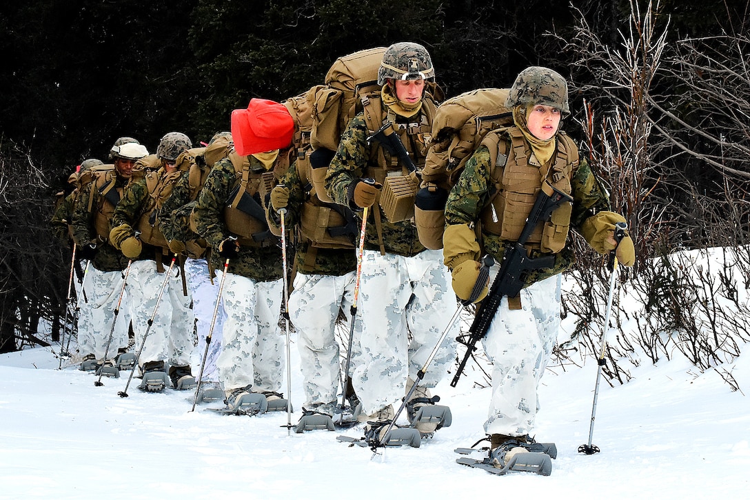 Marines maneuver along Hippie Trail on their way to the biathlon range.