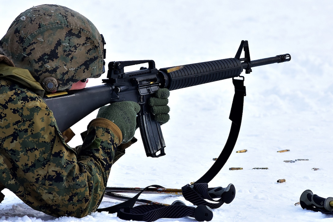 A Marine fire his M16 rifle engaging a target on the biathlon range.