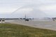 A C-130 Hercules containing Col. Jeffrey Van Dootingh, Commander of the 911th Airlift Wing, taxis under arcs of water as it returns to the flight line at the Pittsburgh International Airport Air Reserve Base, Pa., February 13, 2018. The flight this aircraft was returning from was Van Dootingh’s final flight as the commander of the 911th AW. (U.S. Air Force photo by Senior Airman Beth Kobily)