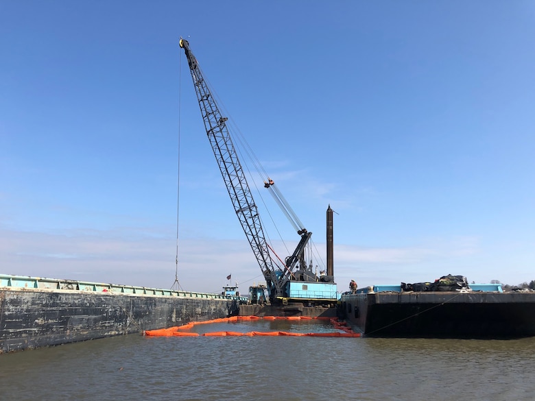 A dredge excavates material from the North Cove Federal Navigation project in Old Saybrook, Connecticut.
