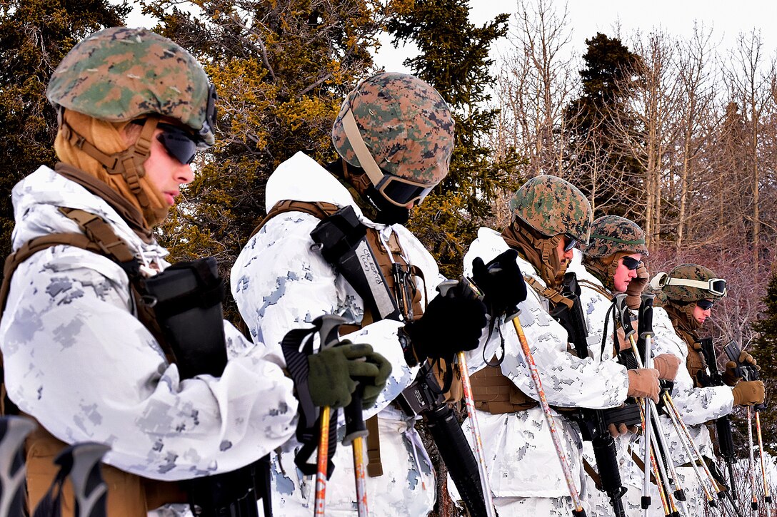 Marines prepare to move to the firing line at the biathlon range.
