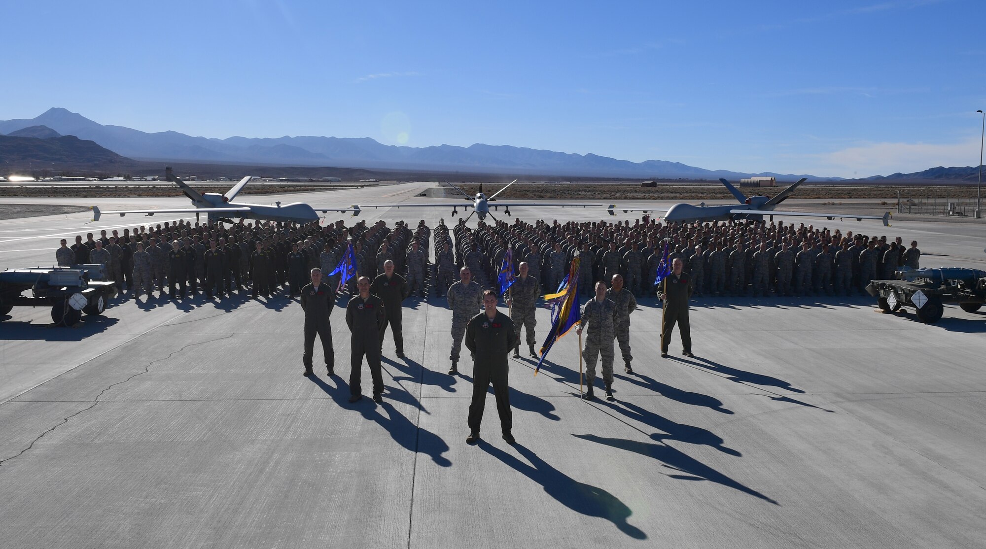 Wing leadership and Airmen of the 432nd Wing/432nd Air Expeditionary Wing stand in formation for their historical wing photo, Feb. 5, 2018 at Creech Air Force Base, Nev. The unit celebrated its 75th anniversary and the many achievements the wing accomplished throughout its history, Feb. 22, 2018 at Creech.
