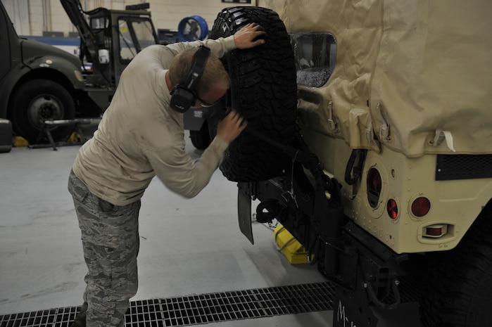 Senior Airman Braxton Willoughby, 628th Logistics Readiness Squadron vehicle maintenance journeyman, completes a vehicle check as part of mobility exercise Bold Eagle Feb. 26, 2018, at Joint Base Charleston, S.C.