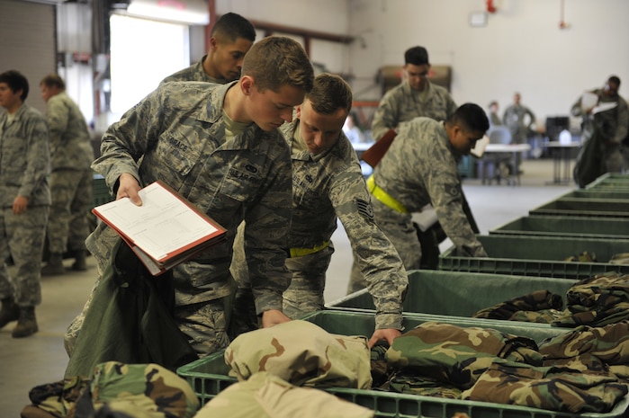 Airmen participating in mobility exercise Bold Eagle are issued individual personal protection equipment Feb. 27, 2018, at Joint Base Charleston, S.C.