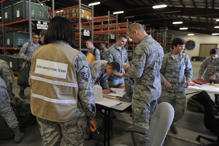 Members of the 628th Logistics Readiness Squadron oversee Airmen processing for a simulated deployment as part of mobility exercise Bold Eagle Feb. 27, 2018, at Joint Base Charleston, S.C. The first phase of the readiness exercise tested Airmen in their ability to deploy quickly and efficiently.