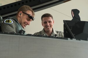 U.S. Air Force Staff Sgt. Ian Ivey, 27th Aircraft Maintenance Unit dedicated crew chief, prepares a 27th Fighter Squadron pilot for his flight at Joint Base Langley-Eustis, Virginia, Feb. 14, 2018. Crew chiefs are responsible for pre-flight and post-flight inspections of their assigned aircraft. (U.S. Air Force photo by Senior Airman Derek Seifert)