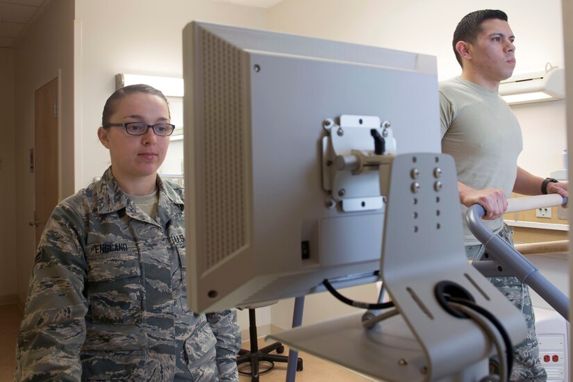 U.S. Air Force Airman 1st Class Alyssa England, 633rd Medical Operations Squadron cardiopulmonary laboratory technician, reads heart electrical activity while Senior Airman Michael Ayala, 633rd MDOS cardiopulmonary laboratory technician, runs on a treadmill at Joint Base Langley-Eustis, Virginia, Feb. 26, 2018. Cardiology patients are evaluated through an attached module that sends activity to a monitor. (U.S. Air Force photo by Airman 1st Class Monica Roybal)