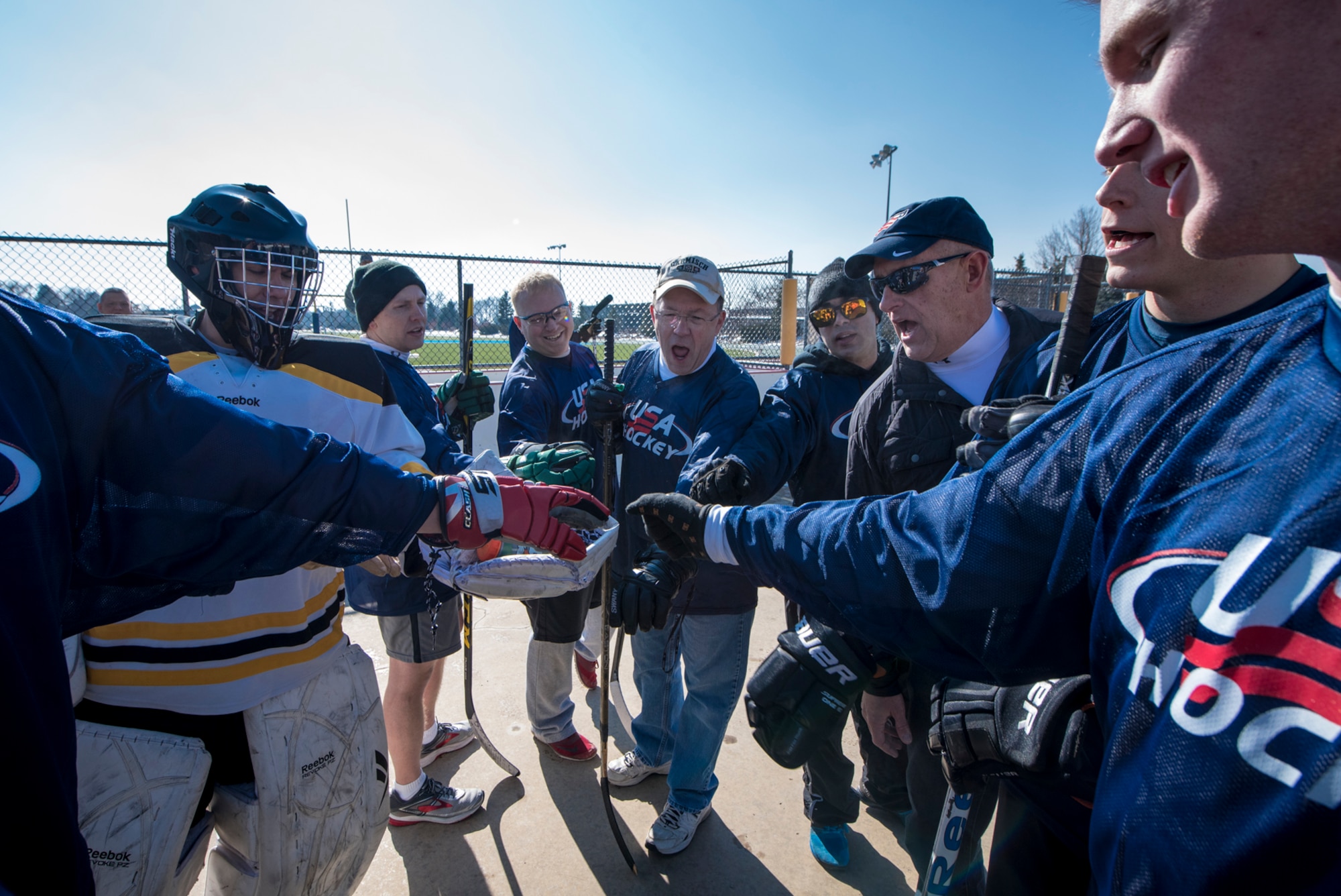 PETERSON AIR FORCE BASE, Colo. –Team U.S. comes together to rally in between the first and second period during the annual USA vs. Canada Ball Hockey Game at Peterson Air Force Base, Colo., Feb. 23, 2018. After three periods of non-stop action, the Americans were victorious with the final score being 3-2. (U.S. Air Force photo by Senior Airman Dennis Hoffman)