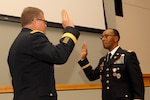 DLA Troop Support Commander Army Brig. Gen. Mark Simerly, left, administers the Army oath of office for newly promoted Chief Warrant Officer Five Timothy Hagans, during a ceremony in Hagans’ honor Feb. 23, 2018 in Philadelphia. Hagans served as a military food advisor within DLA Troop Support’s Subsistence supply chain for the last four years.