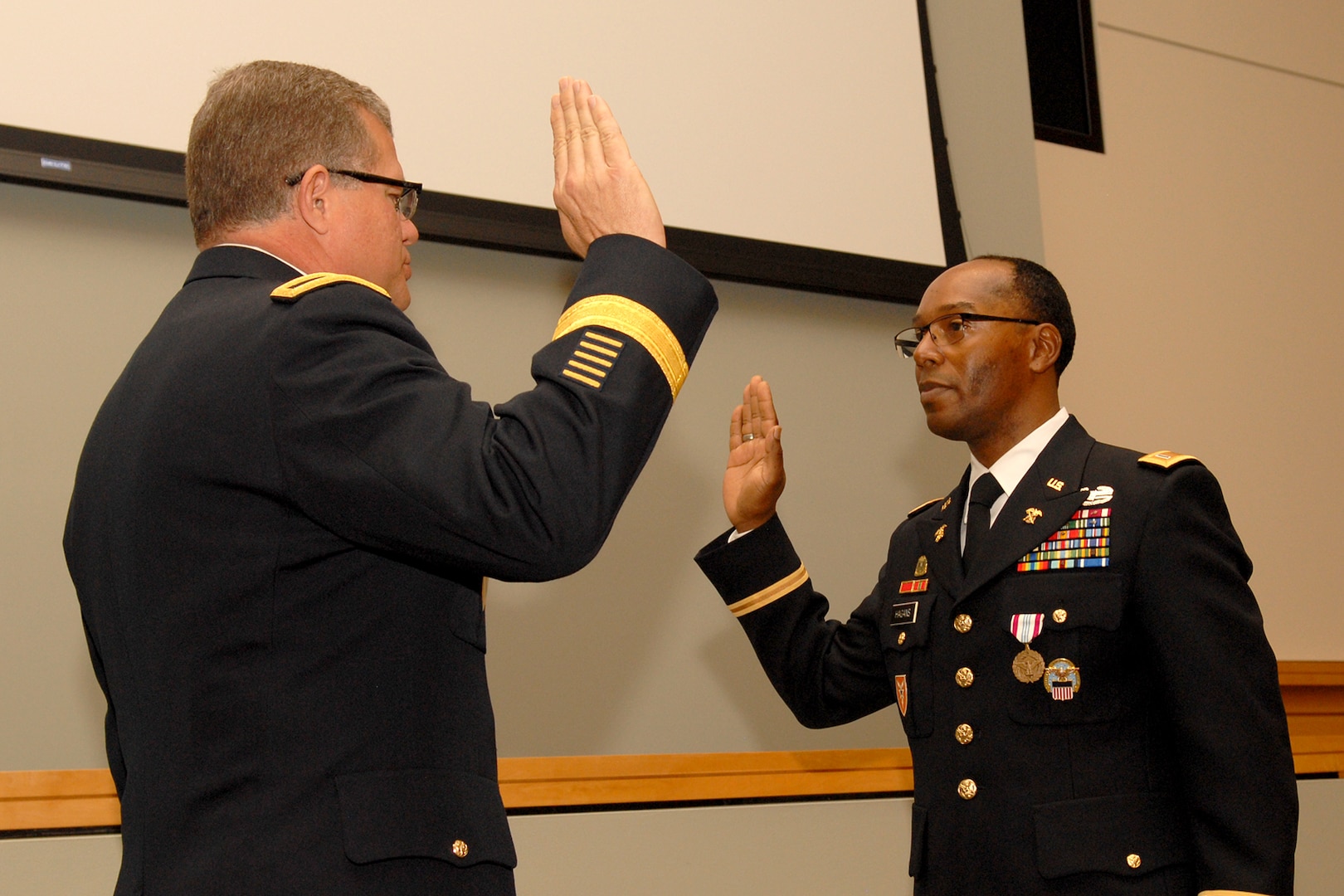 DLA Troop Support Commander Army Brig. Gen. Mark Simerly, left, administers the Army oath of office for newly promoted Chief Warrant Officer Five Timothy Hagans, during a ceremony in Hagans’ honor Feb. 23, 2018 in Philadelphia. Hagans served as a military food advisor within DLA Troop Support’s Subsistence supply chain for the last four years.