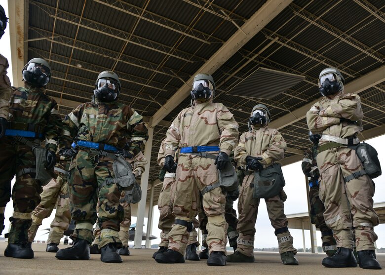 U.S. Air Force Airmen wait for further guidance during a Chemical Attack Survival Familiarization exercise at Joint Base Langley- Eustis, Virginia, Feb. 26, 2018.