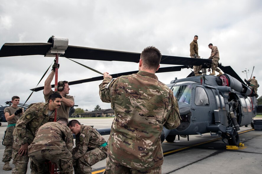 Airmen from the 723d Aircraft Maintenance Squadron (AMXS), align the rotor of an HH-60G Pavehawk, Feb. 27, 2018, at Moody Air Force Base, Ga.  They were evaluated on their ability to unfold the tail and main rotors of a Pavehawk to practice making the helicopter operational in a limited amount of time. (U.S. Air Force photo by Airman Eugene Oliver)