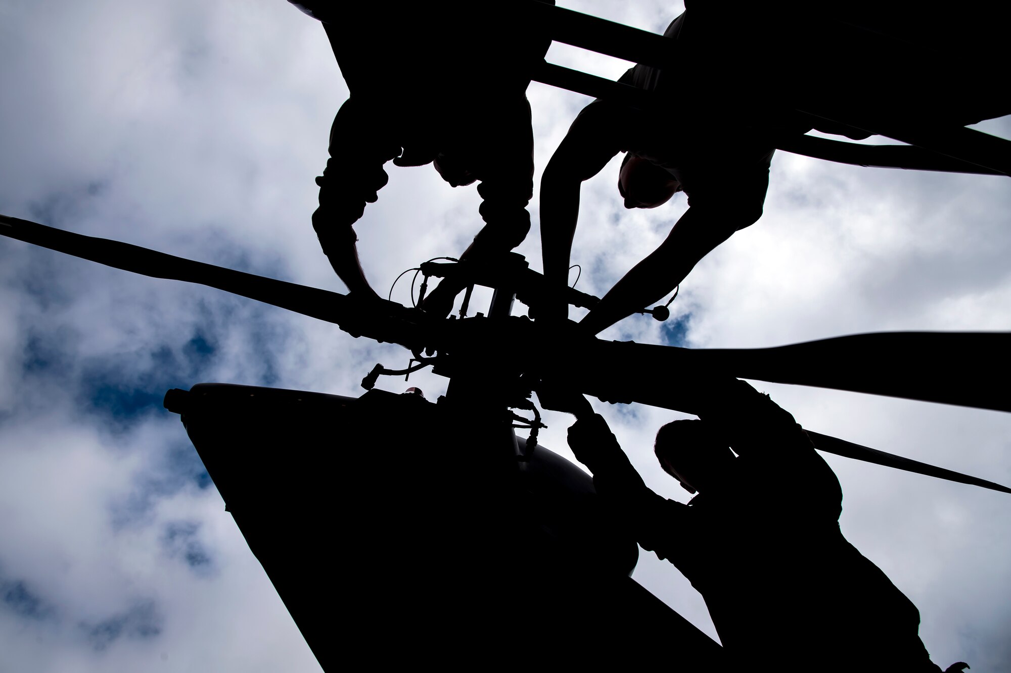 Airmen from the 723d Aircraft Maintenance Squadron (AMXS), perform maintenance on the rotor of an HH-60G Pavehawk, Feb. 27, 2018, at Moody Air Force Base, Ga. They were evaluated on their ability to unfold the tail and main rotors of a Pavehawk to practice making the helicopter operational in a limited amount of time.  (U.S. Air Force photo by Airman Eugene Oliver)