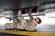 An Airman from the 723d Aircraft Maintenance Squadron (AMXS), grabs a cargo hook from underneath an HH-60G Pavehawk, Feb. 27, 2018, at Moody Air Force Base, Ga. They were evaluated on their ability to unfold the tail and main rotors of a Pavehawk to practice making the helicopter operational in a limited amount of time.(U.S. Air Force photo by Airman Eugene Oliver)