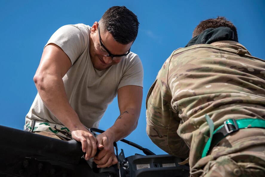 Senior Airman Nicholas Rodriguez, 723d Aircraft Maintenance Squadron (AMXS) crew chief, adjusts the rotor of an HH-60G Pavehawk, Feb. 27, 2018, at Moody Air Force Base, Ga. They were evaluated on their ability to unfold the tail and main rotors of a Pavehawk to practice making the helicopter operational in a limited amount of time. (U.S. Air Force photo by Airman Eugene Oliver)