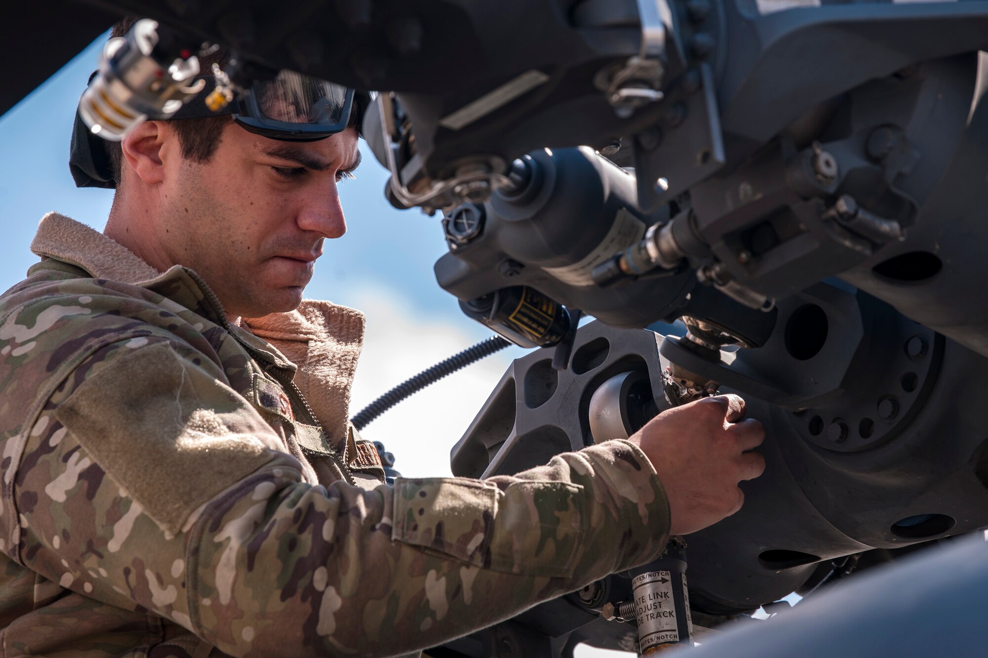 Staff Sgt. Anthony Staley, 723d Aircraft Maintenance Squadron (AMXS) crew chief, loosens a bolt on the rotor of an HH-60G Pavehawk, Feb. 27, 2018, at Moody Air Force Base, Ga. They were evaluated on their ability to unfold the tail and main rotors of a Pavehawk to practice making the helicopter operational in a limited amount of time. (U.S. Air Force photo by Airman Eugene Oliver)
