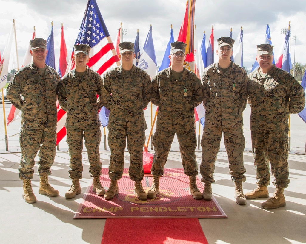 U.S. Marines recognized as Noncommissioned Officer of the Quarter and Marine of the Quarter pose for a picture (left to right ) with Brig. Gen. Kevin J. Killea, Commanding General, Marine Corps Installations-West, Marine Corps Base Camp Pendleton, Lance Cpl Kyle A. Montoya, with Marine Corps Tactical System Support Activity, Marine Corps Base Camp Pendleton, Sgt. David S. Perezsosa, with Security and Emergency Services Battalion, Marine Corps Base Camp Pendleton, Cpl. Uriah A. Richards, with Headquarters and Headquarters Squadron, Marine Corps Air Station Camp Pendleton, Cpl. Anthony B. Zawalski, with Headquarters and Headquarters Squadron, Marine Corps Air Station Yuma, and Sgt.Maj. Julio E. Meza, Sergeant Major, Marine Corps Installations-West, aboard Marine Corps Base Camp Pendleton, Feb. 22, 2018. The designation was established to provide acknowledgement  to enlisted Marines who have demonstrated exceptional performance both on and off duty.   (U.S. Marine Corps photos by Lance Cpl Megan Roses)