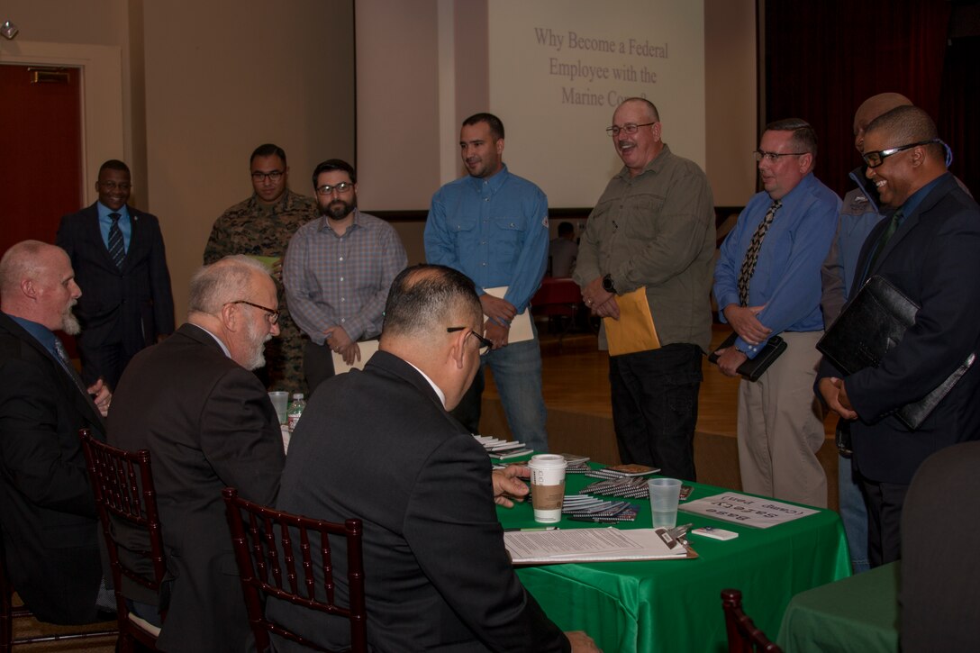 Representatives with Base Safety speak to candidates during Operation Rapid Hire 2.0 at the Pacific Views Event Center on Camp Pendleton, Calif., Feb. 27, 2018. Operation Rapid Hire 2.0 is a hiring initiative sponsored by Marine Corps Installations West Civilian Human Resources Office and Marine Corps Community Services. For notifications about upcoming career events as well as registration information, visit www.mccscp.com/careerevents. (U.S. Marine Corps photo by Cpl. Andre Heath)