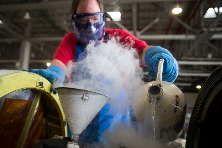 A member of NASA’s HyspIRI preparatory campaign pours liquid nitrogen into the ER-2 aircraft’s hyperspectral thermal emission spectrometer, Marine Corps Air Station Kaneohe Bay, Feb. 2, 2018. The instrument supports the campaign’s goal to gather environmental data from the Hawaiian Islands, such as coral reef health and volcanic activity, to ultimately pave the way for the deployment of a satellite sharing the same mission. (U.S. Marine Corps photo by Lance Cpl. Luke Kuennen)