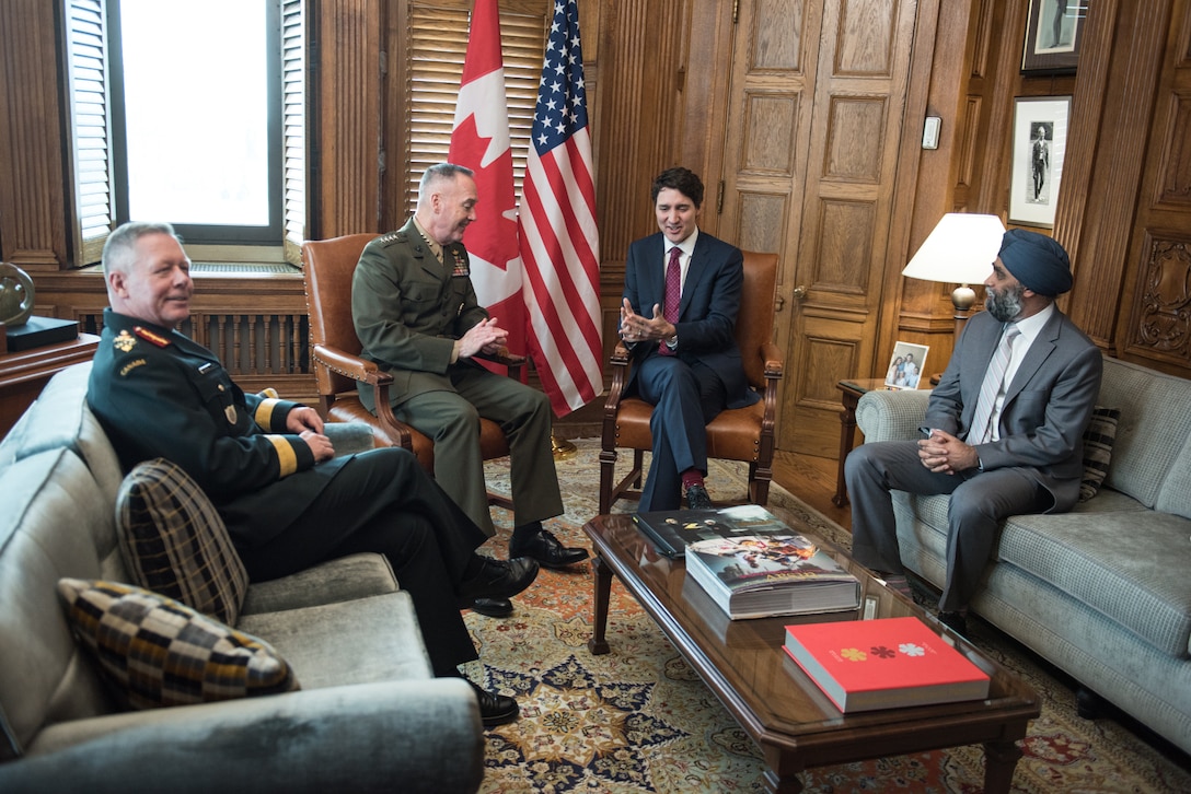 Marine Corps Gen. Joe Dunford, chairman of the Joint Chiefs of Staff sits with Canadian officials.