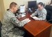 Airman 1st Class Benjamin Kriz, 412th Aircraft Maintenance Squadron Joint Strike Fighter Aircraft Maintenance Unit (left)
works with the new airman dorm leader, Staff Sgt. Marcos Martinez to obtain a room for an arriving Airman. (Courtesy photo by R.C. Morgan)