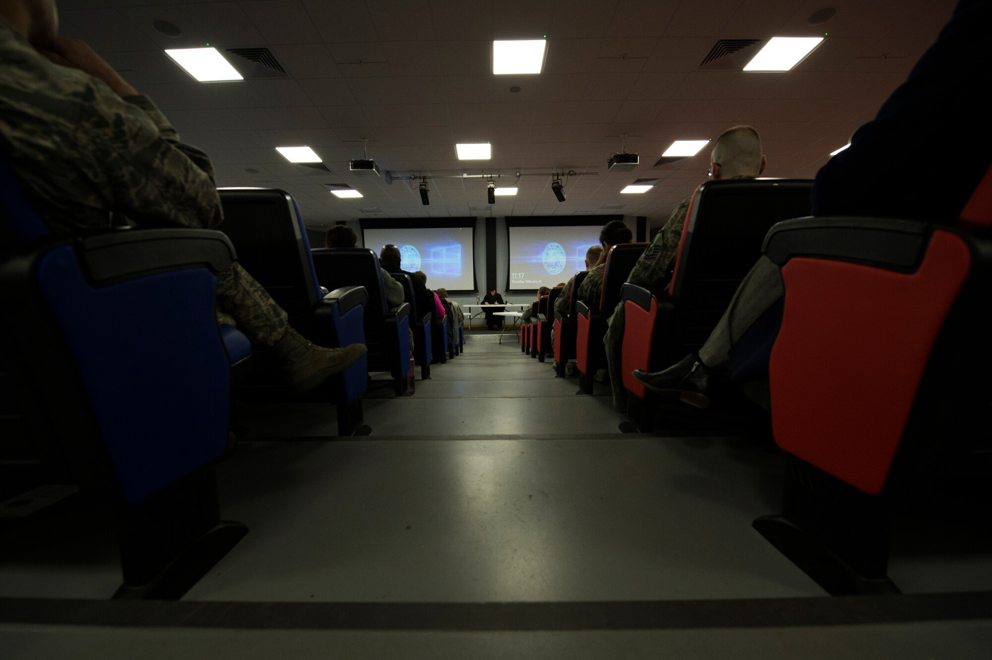 (courtesy photo) The audience, including Airmen from the 501st Combat Support Wing, settle in to begin viewing a mock trial at the Strike Eagle complex at Royal Air Force Lakenheath, England, Feb. 22, 2018. Attorneys playing the role of the prosecution and defense conducted witness and victim questioning while on the stand. (U.S. Air Force photo/Airman 1st Class Shanice Williams-Jones)