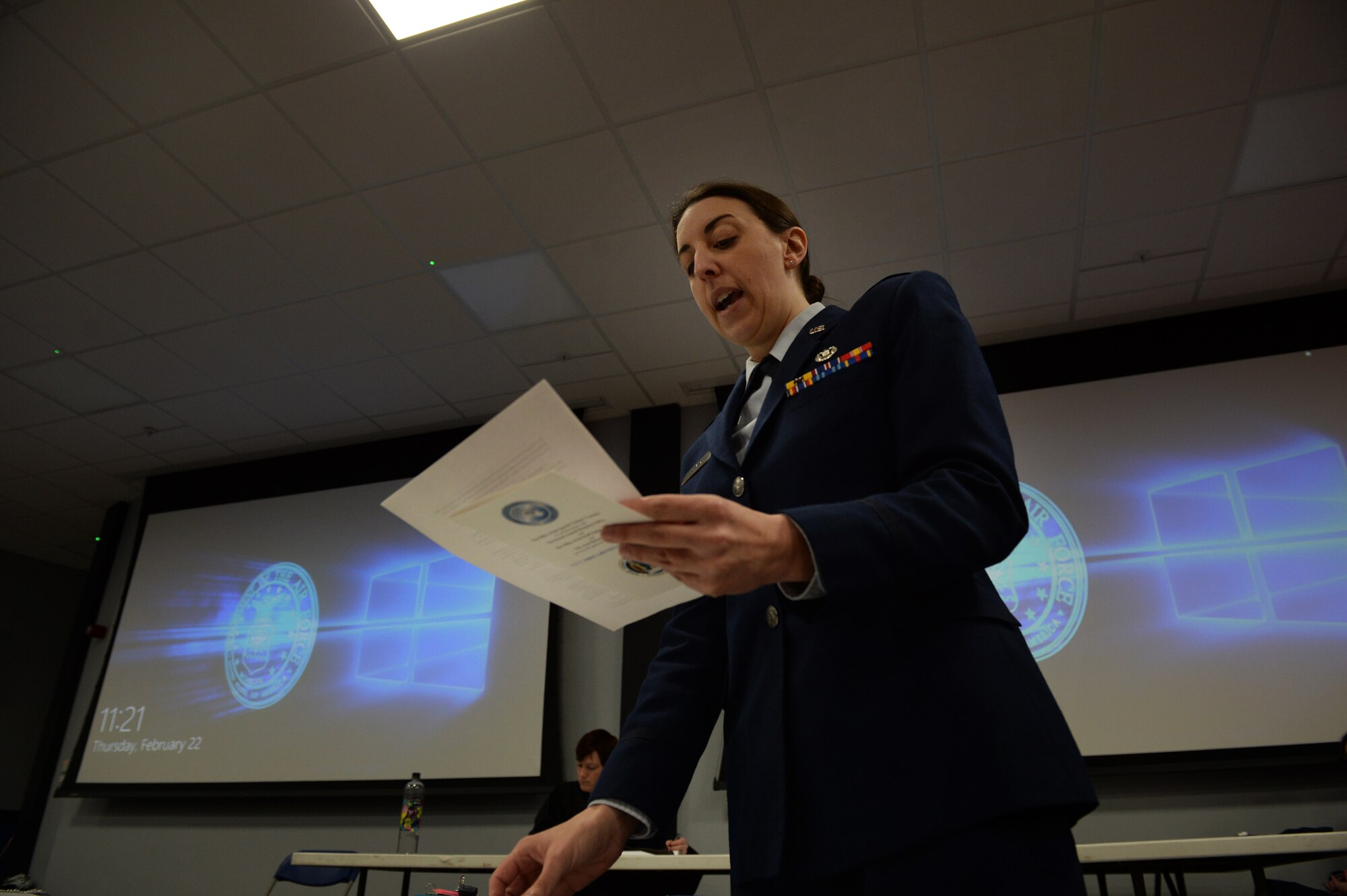 (courtesy photo) Maj. Julie A. Beyer, an area defense counsel assigned to the Air Force Legal Operations Agency, reads from her files during a mock trial at the Strike Eagle Complex at Royal Air Force Lakenheath, England, Feb. 22, 2018. During the skit, she argued her belief that the prosecutor had not met the burden of proof for sexual assault and therefore, her client was not guilty. (U.S. Air Force photo/Airman 1st Class Shanice Williams-Jones)