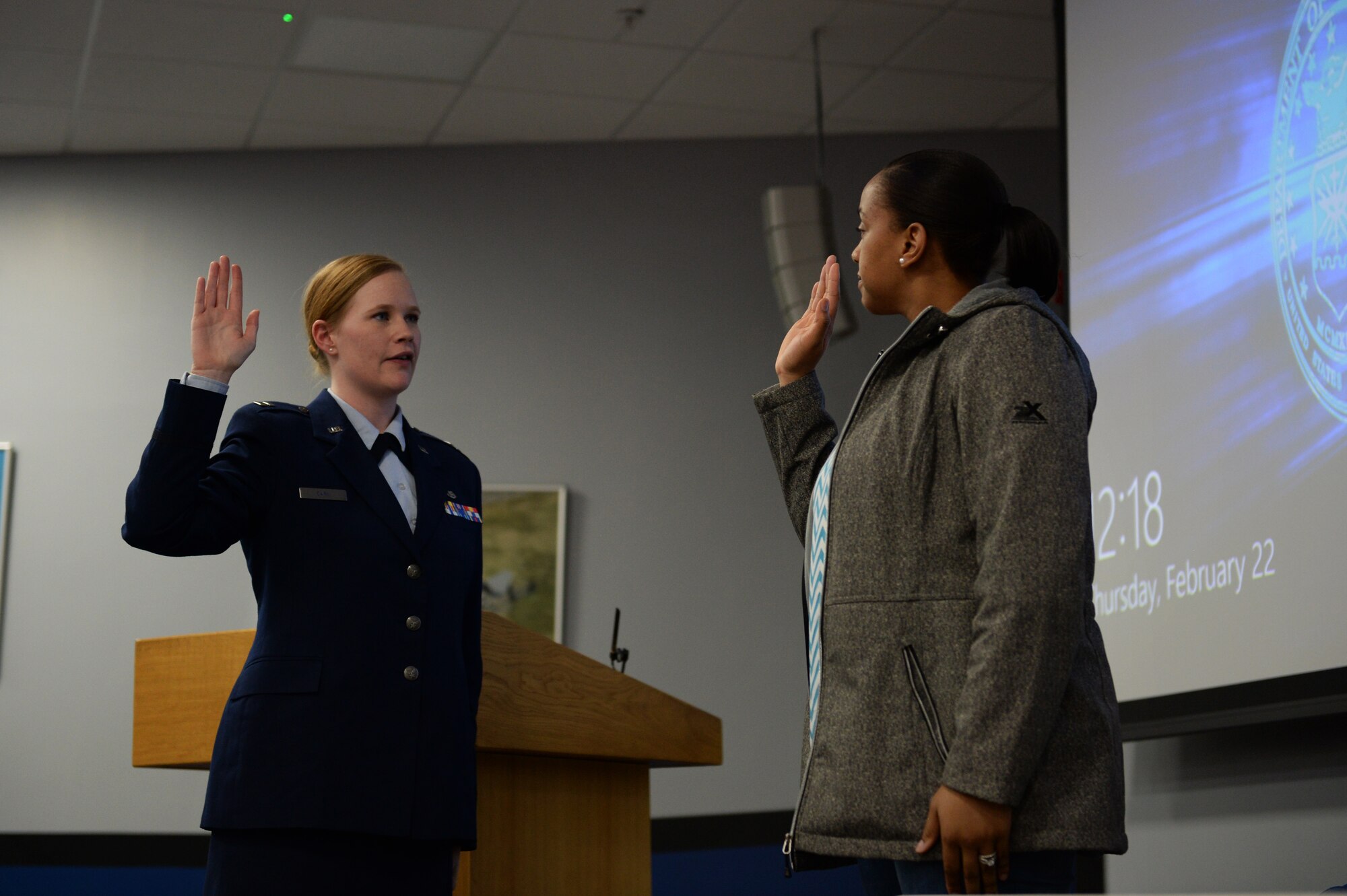 (courtesy photo) Capt. Kristin A. Carl, the special victims’ counsel for the 501st Combat Support Wing, assigned to the Air Force Legal Operations Agency, administers an oath to a witness during a mock trial at the Strike Eagle Complex at Royal Air Force Lakenheath, England, Feb. 22, 2018. The witness played the role of the wife of the accused and provided a perspective of how family members are affected by court proceedings. (U.S. Air Force photo/Airman 1st Class Shanice Williams-Jones)