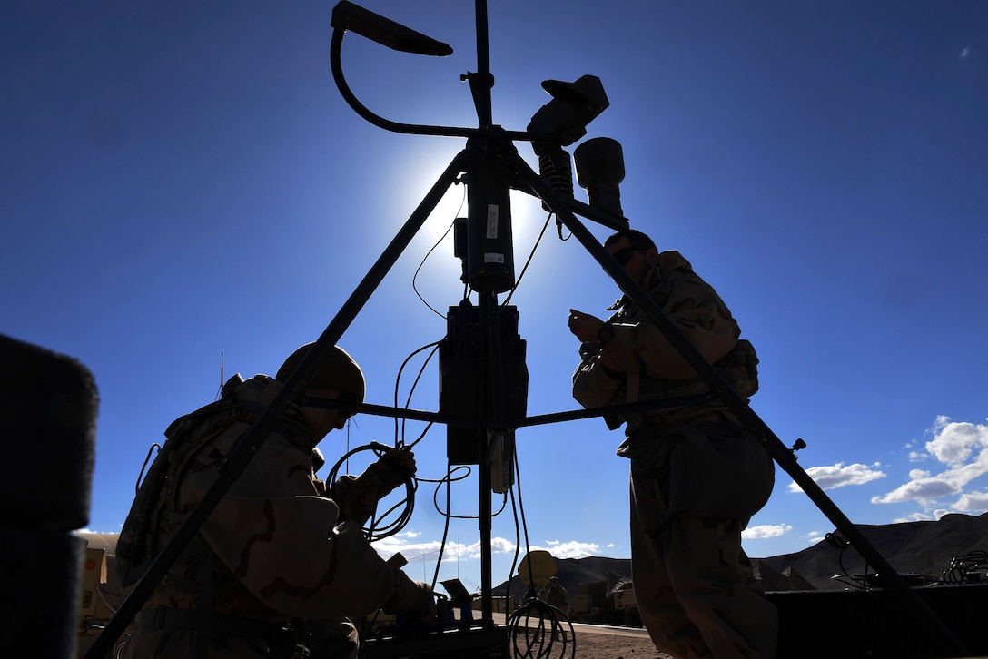 Weather forecasters from the 3d Air Support Operations Group assemble a tactical meteorological observing system during a pre-deployment rotation at Ft. Irwin, California’s National Training Center, Feb. 21, 2018. During their month-long NTC rotation, Air Force weather assets from various units within the 93d Air Ground Operations Wing advised, trained and assisted Army units to exploit weather and environmental conditions as they battled mock adversaries. As the Army’s sole weather support asset, the training maximized integration in a hostile environment to enhance interoperability and assure mission success. (U.S. Air Force photo Senior Airman Greg Nash)