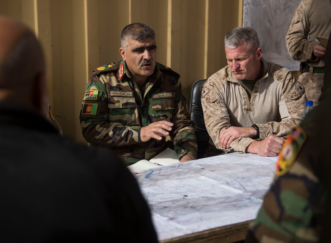 Afghan National Army Brig. Gen. Abdul Hadi, the deputy commander of the 215th Corps, discusses future objectives during a key leader engagement in Helmand Province, Afghanistan, Dec. 26, 2017. Task Force Southwest is advising and assisting the 1st Brigade as they clear southern Marjah as part of the Maiwand 10 mission. This is a joint operation with maneuver elements from the Afghan National Army, National Directorate of Security and Afghan National Police forces. (U.S. Marine Corps photo by Sgt. Justin T. Updegraff)