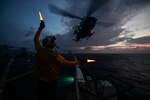 Aviation Boatswain Mate Handling Airman Ryan Sharland directs a UH-1Y Venom, assigned to Marine Medium Tiltrotor Squadron (VMM) 161 (reinforced) on the flight deck of the amphibious transport dock ship USS San Diego (LPD 22). San Diego, part of the America Amphibious Ready Group, with embarked 15th MEU, is operating in the Indo-Asia Pacific region to strengthen partnerships and serve as a ready-response force for any type of contingency.