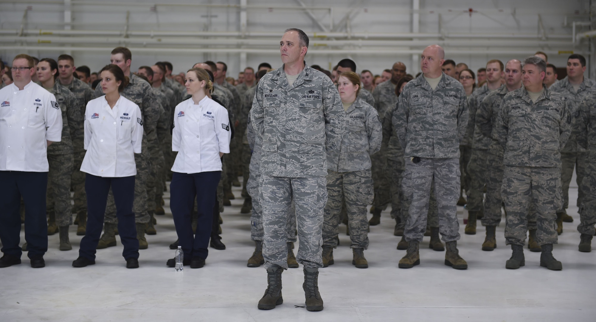 U.S. Air Force Airmen from the133rd Airlift Wing, along with friends and family members of U.S. Air Force Cols. James Johnson and Daniel Gabrielli, gather for a change of command ceremony in St. Paul, Minn., Apr. 16, 2016.