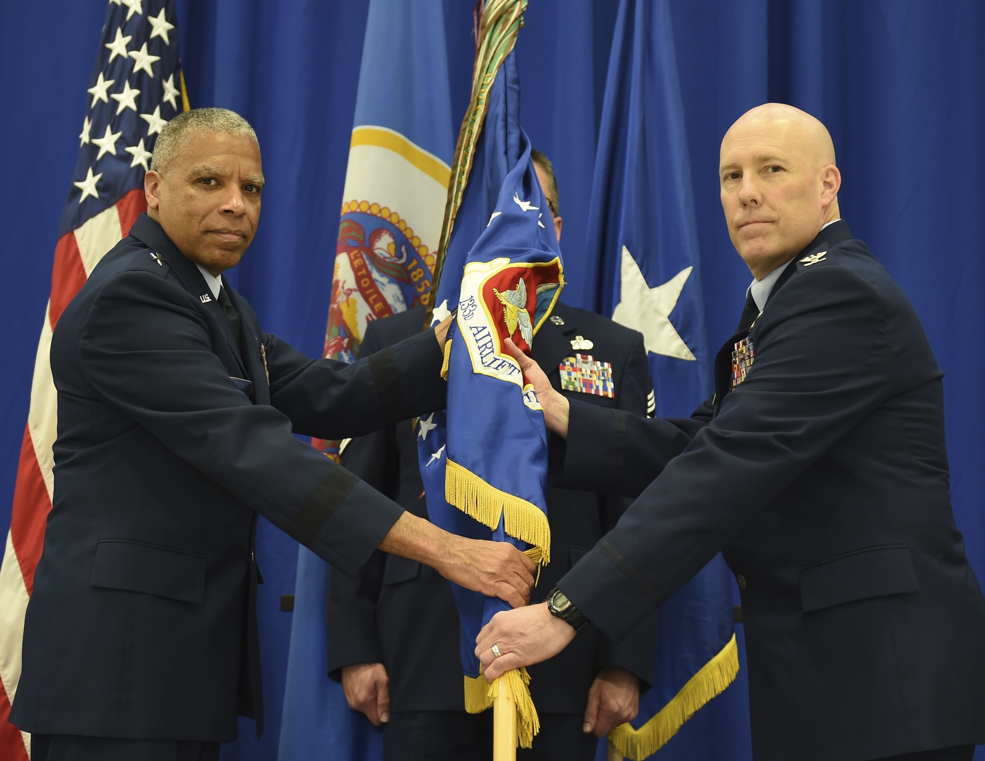 U.S. Air Force Col. Daniel Gabrielli, right, receives command of the 133rd Airlift Wing from Brig. Gen. David Hamlar, Assistant General Air National Guard, in St. Paul, Minn., Apr. 16, 2016.