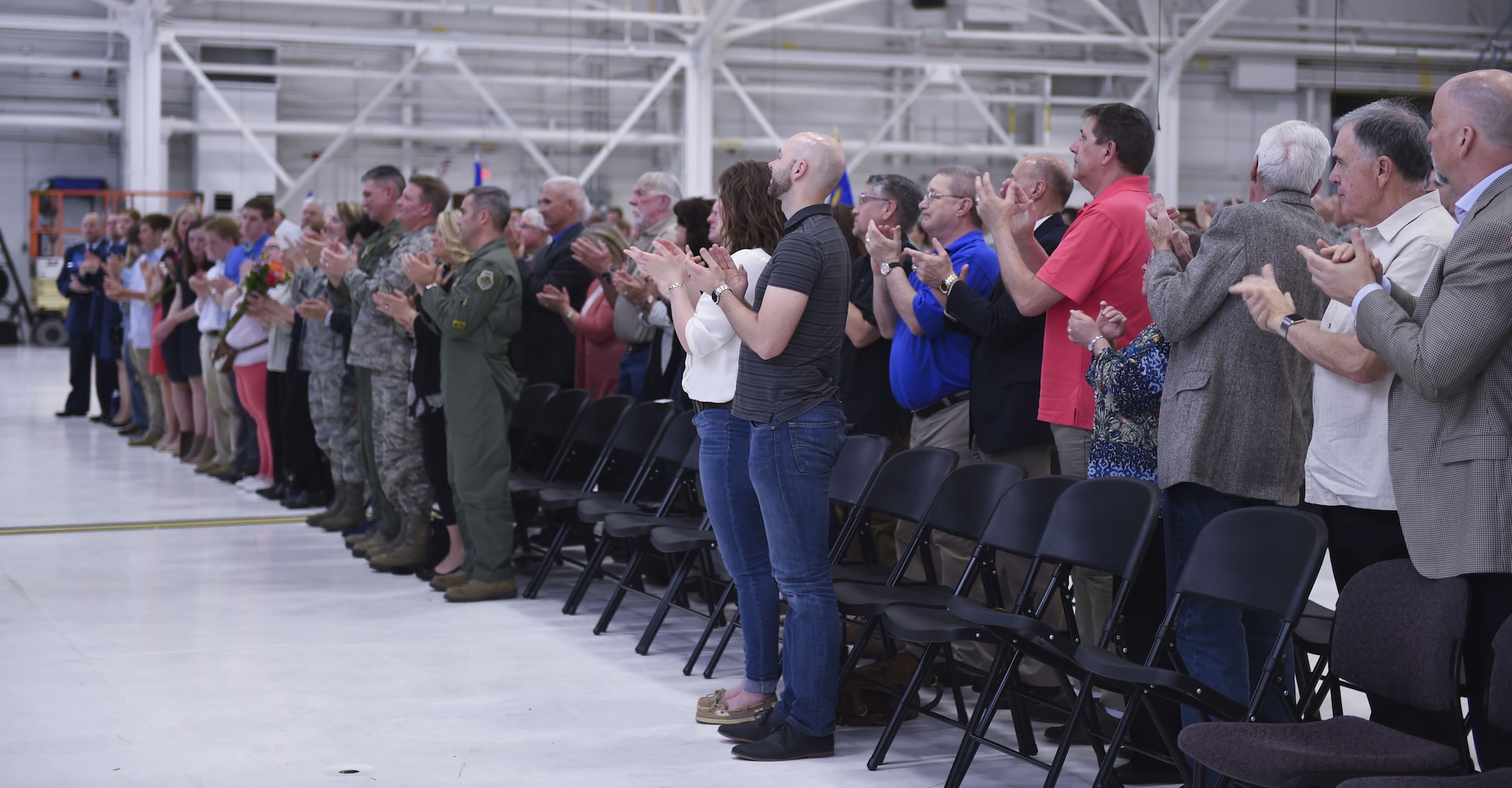 U.S. Air Force Airmen from the133rd Airlift Wing, along with friends and family members of U.S. Air Force Cols. James Johnson and Daniel Gabrielli, gather for a change of command ceremony in St. Paul, Minn., Apr. 16, 2016.