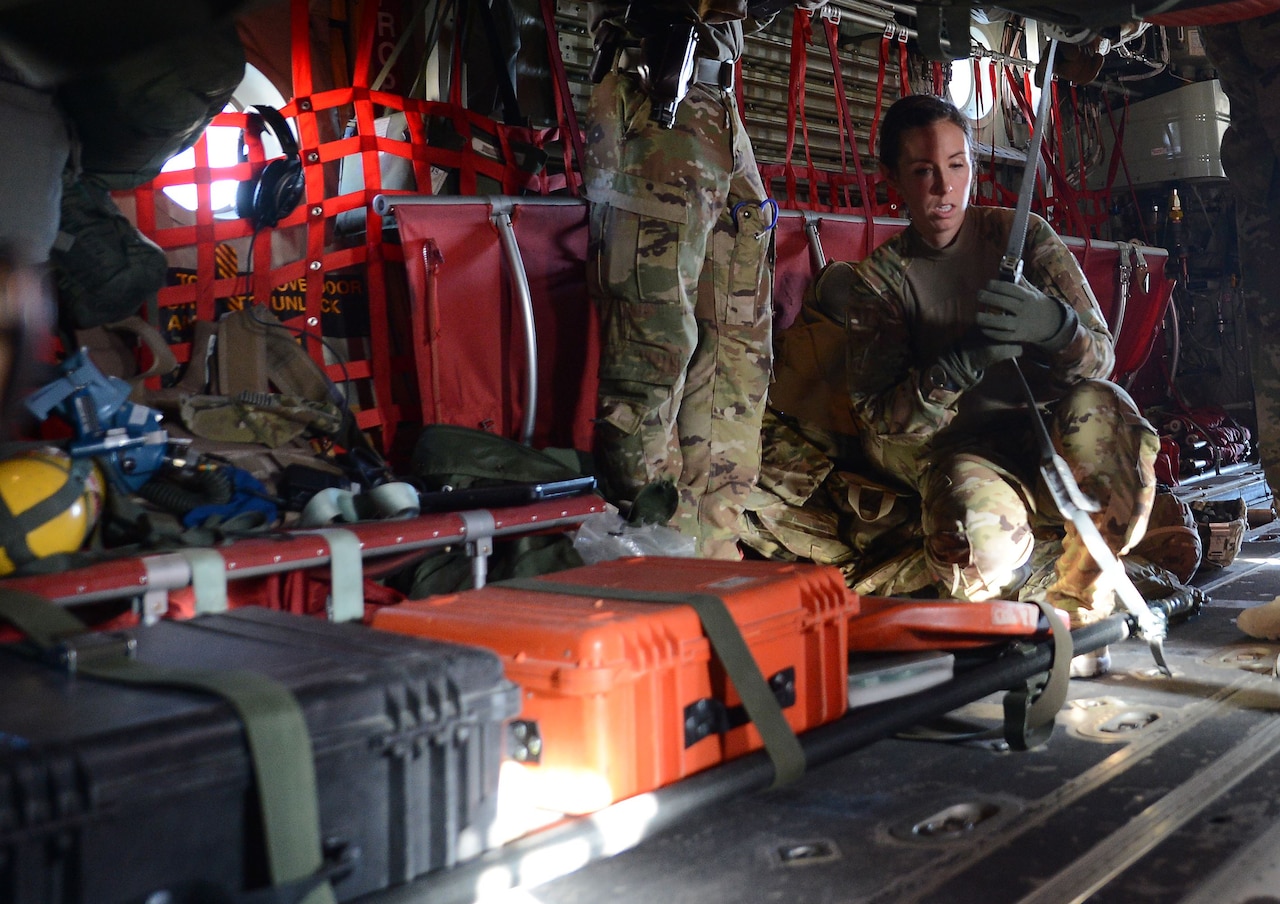 Capt. Asha Wyatt, 455th Expeditionary Aeromedical Evacuation Squadron aeromedical evacuation operations officer and flight nurse, configures AE equipment Dec. 28, 2017 at Bagram Airfield, Afghanistan.