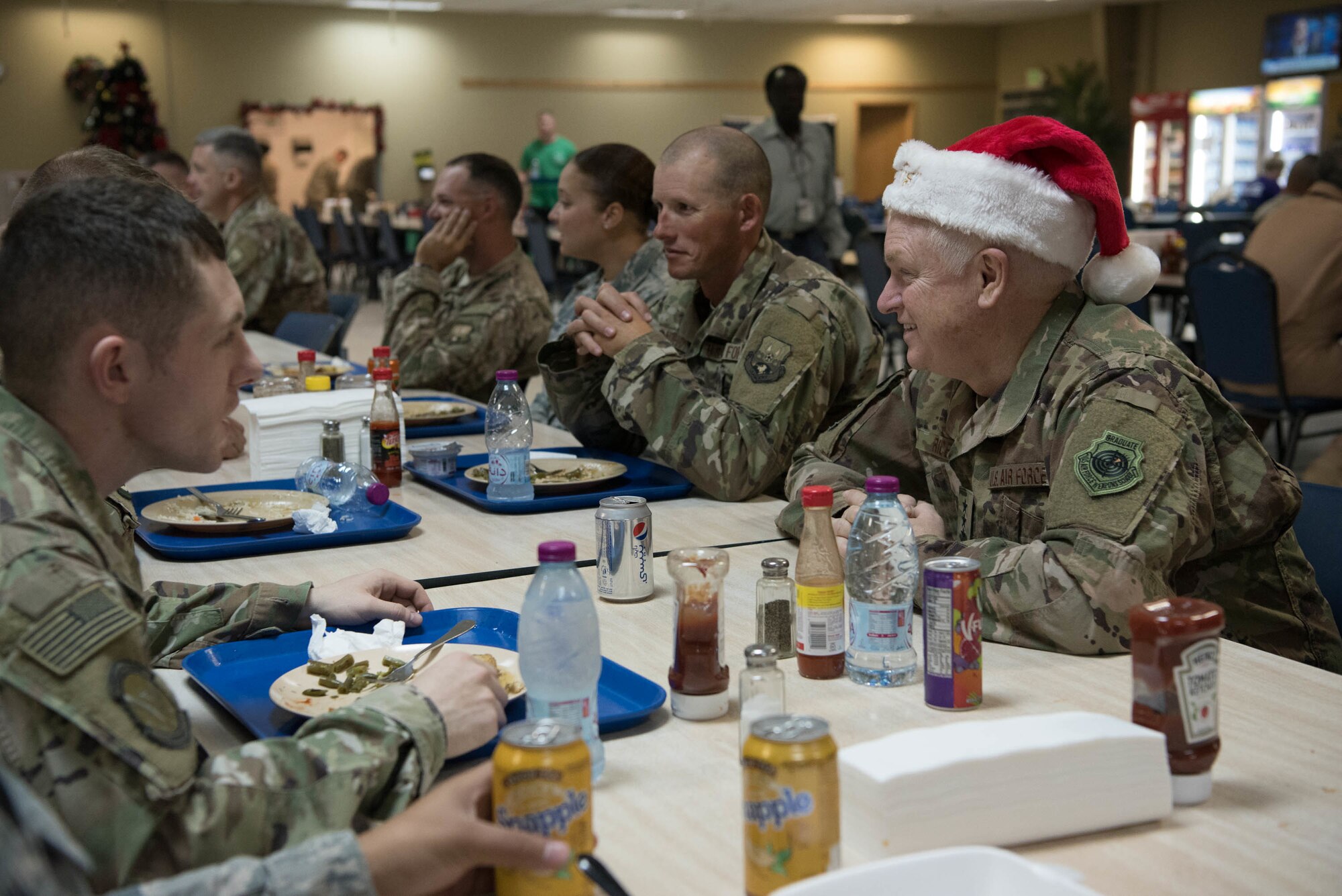 Lt. Gen. L. Scott Rice, director of the Air National Guard, has lunch with deployed Air National Guardsmen at Al Udeid Air Base, Qatar, Dec. 24, 2017. Rice visited deployed Air National Guardsmen at AUAB on Christmas Eve during a trip to the U.S. Central Command area of responsibility. (U.S. Air National Guard photo by Master Sgt. Phil Speck)