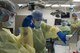 U.S. Air Force Staff Sgt. Clarissa Ernst, left, Cardiopulmonary technician and Airman 1st Class Elliot Sotnek, right, Aerospace Medical Technician, 88th Medical Operations Squadron, remove tissue from a patient’s Endobronchial Ultrasound Sampling Fine Needle Aspirate inside the operating room at Wright-Patterson Air Force Base Medical Center, June 26, 2017. The tissue is then smeared onto a glass slide and examined under a microscope by a pathologist. (U.S. Air Force photo by Michelle Gigante)