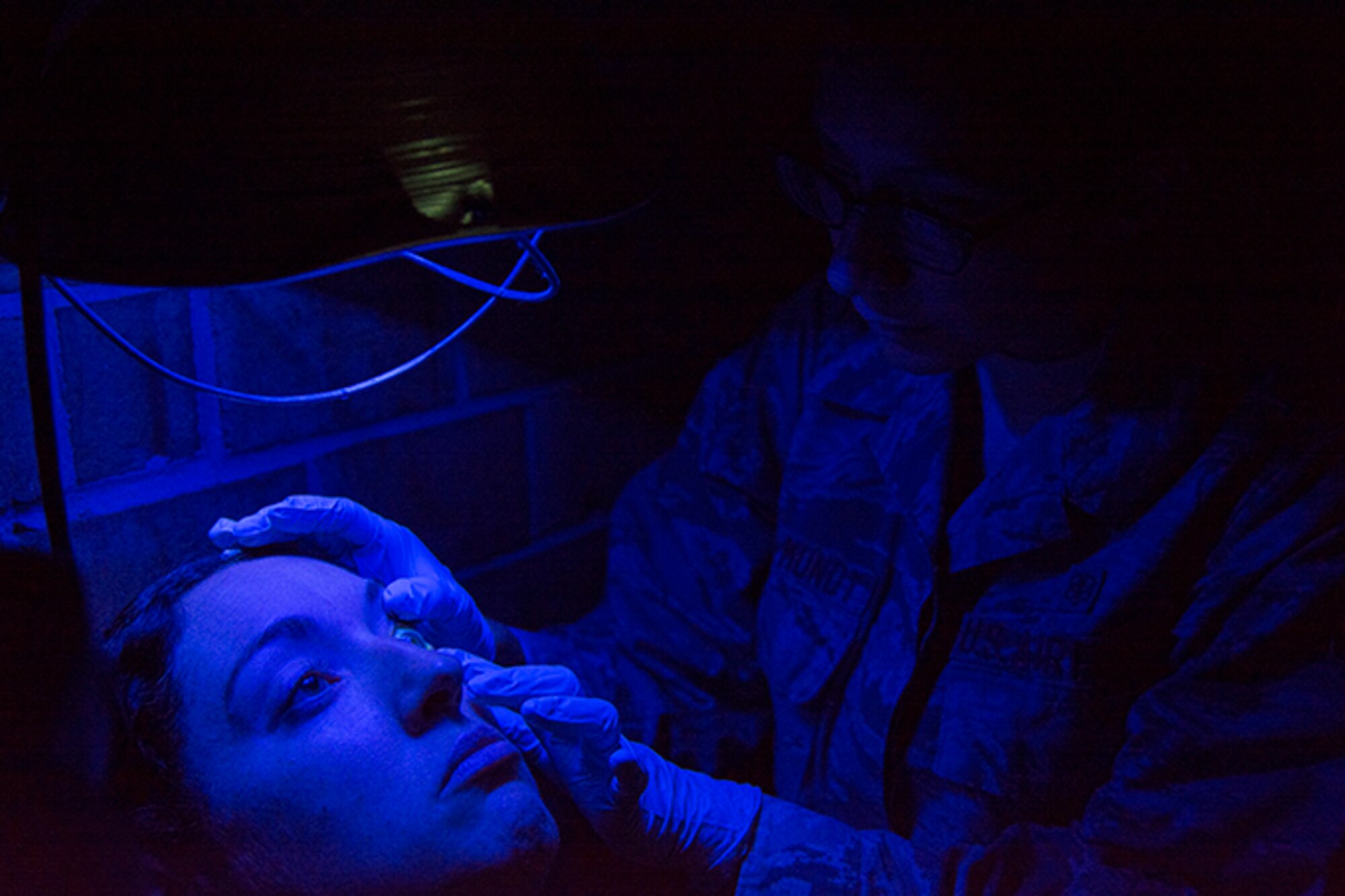 Senior Airman Desire Mora-Mundt, an optometry technician assigned to the 434th Air Refueling Wing, Grissom Air Base conducts a vision exam on a patient in Swain County during the Smoky Mountain Medical Innovative Readiness Training in Bryson City, N.C., Aug. 5, 2017. The program provides no cost medical, dental, ophthalmologic, and veterinary services to residents of Clay County, Swain County and the surrounding areas. (U.S. Air Force photo by Senior Airman Damien Taylor)