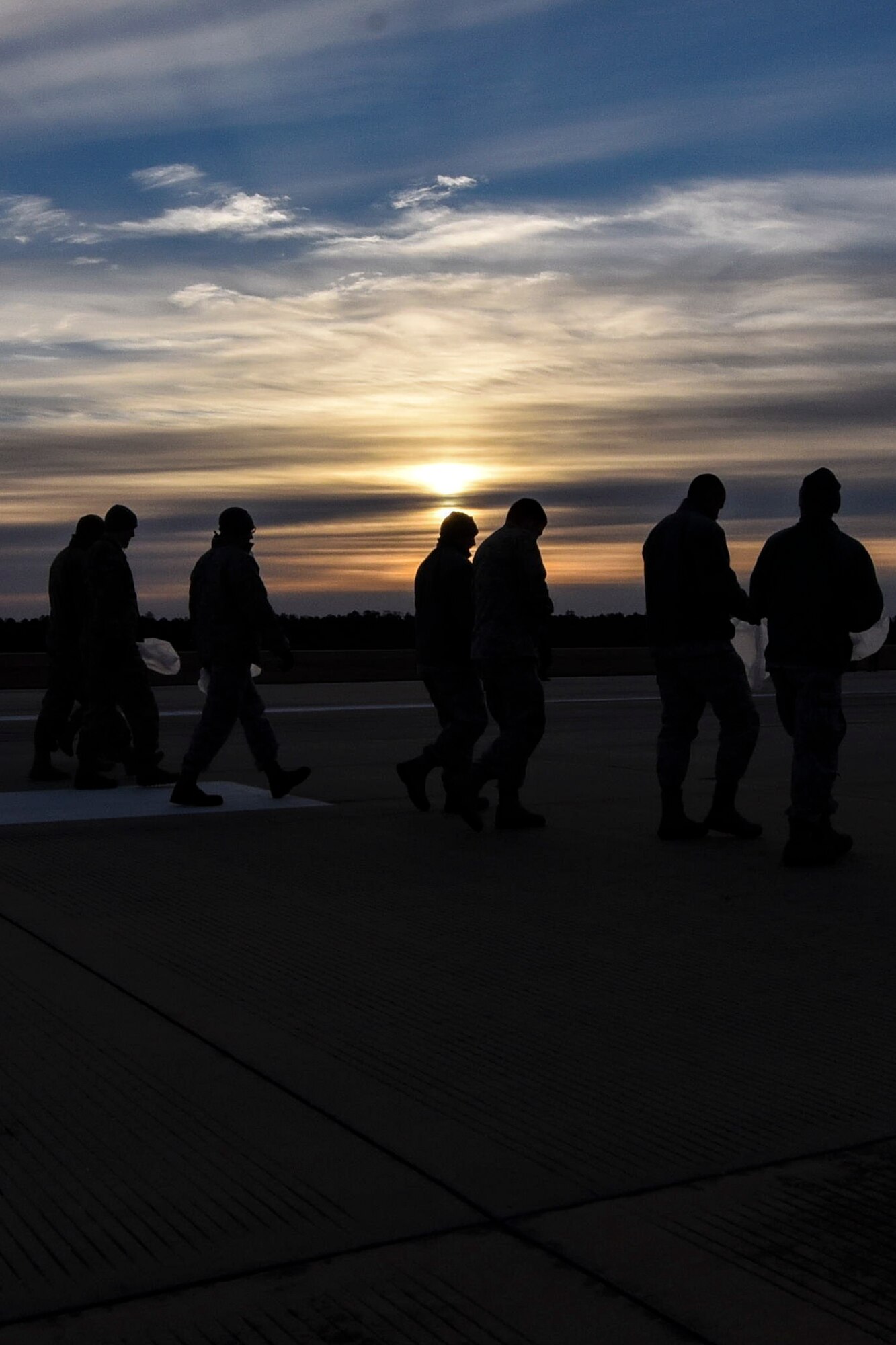 Team Moody Airmen inspect the flight line during a foreign object debris (FOD) walk, Jan. 2, 2018, at Moody Air Force Base, Ga.  The FOD walk was performed following the winter holidays to remove any debris that could potentially cause damage to aircraft or vehicles. (U.S. Air Force photo by Airman Eugene Oliver)
