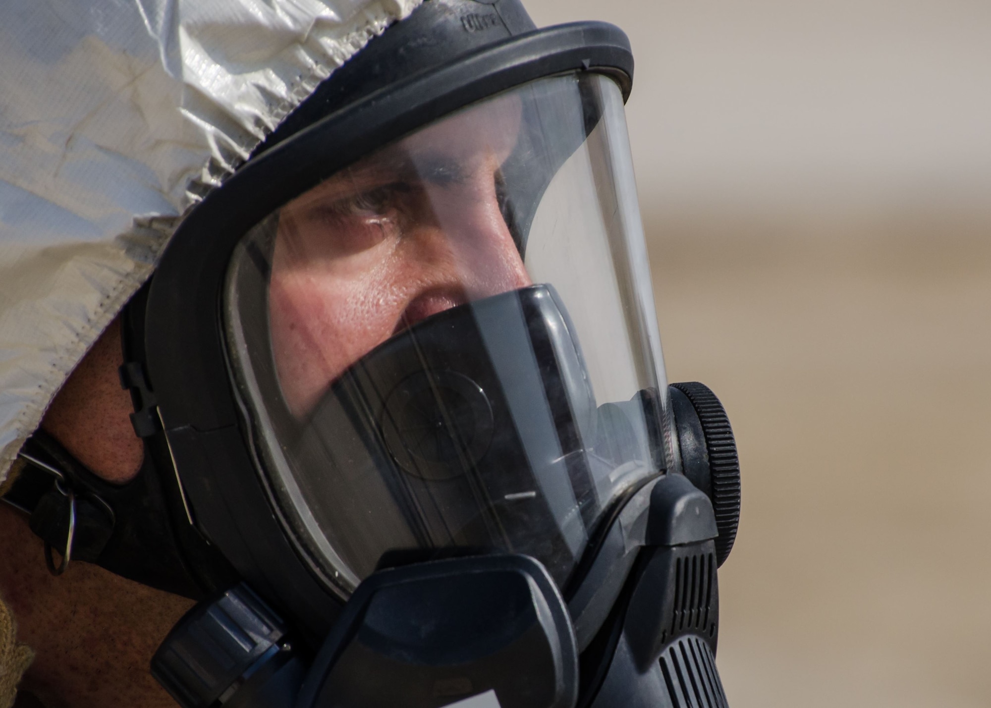 Tech Sgt. Charles Piccolomini, 380th Expeditionary Civil Engineer Squadron, explosive ordnance disposal, logistics section chief, observers the scene of an F-22 Raptor crash during the base-wide Major Accident Response Exercise at Al Dhafra Air Base, United Arab Emirates Dec. 15, 2017. EOD is trained to detect, disarm, detonate and dispose of explosive threats. (U.S. Air National Guard Photo by Staff Sgt. Colton Elliott)