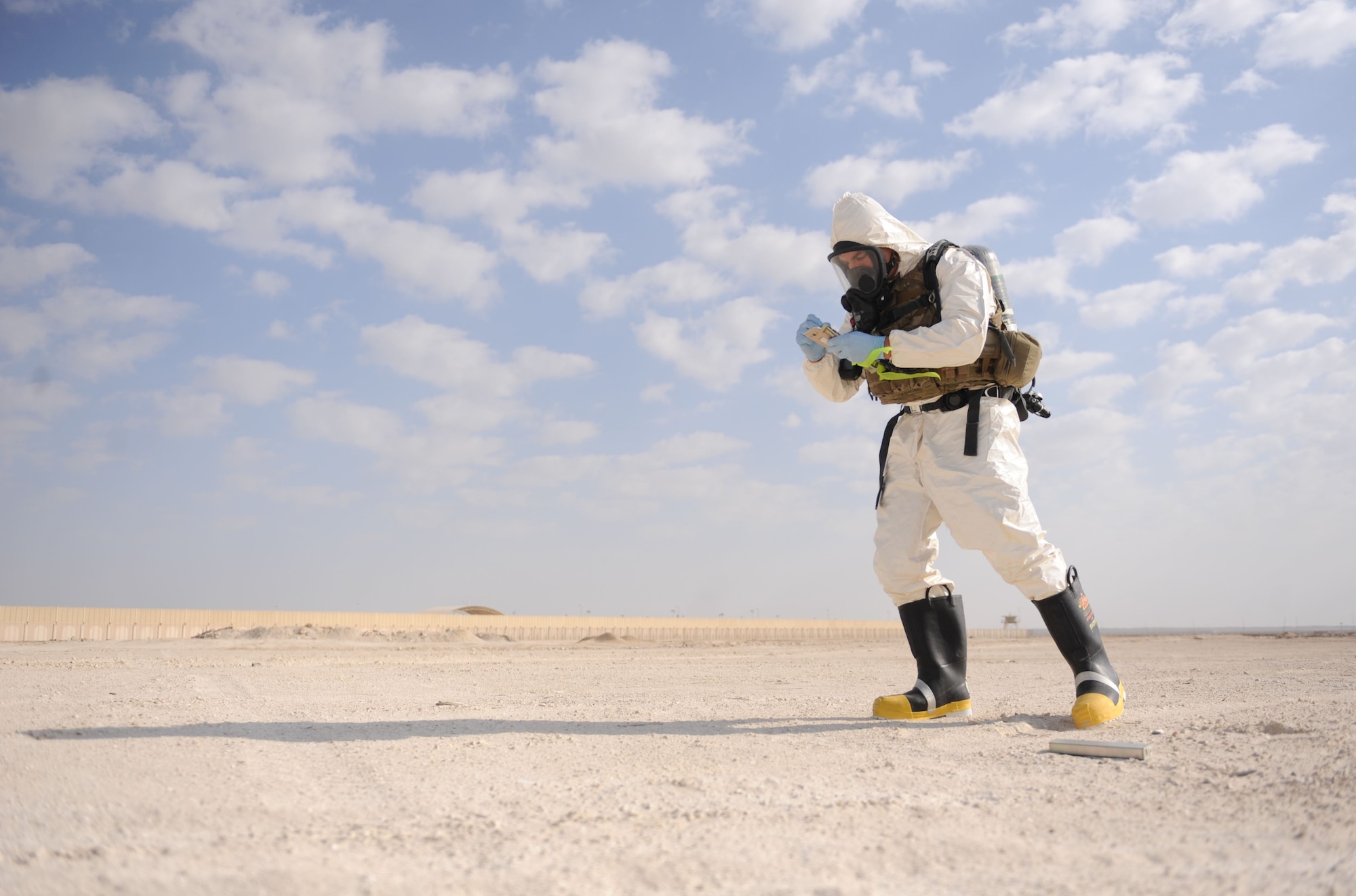 Staff Sgt. Benjamin Young, 380th Expeditionary Civil Engineer Squadron, explosive ordnance disposal, training noncommissioned officer in charge, evaluates the scene of an F-22 Raptor crash during the Major Accident Response Exercise at Al Dhafra Air Base, United Arab Emirates Dec. 15, 2017. EOD is trained to detect, disarm, detonate and dispose of explosive threats. (U.S. Air National Guard Photo by Staff Sgt. Colton Elliott)