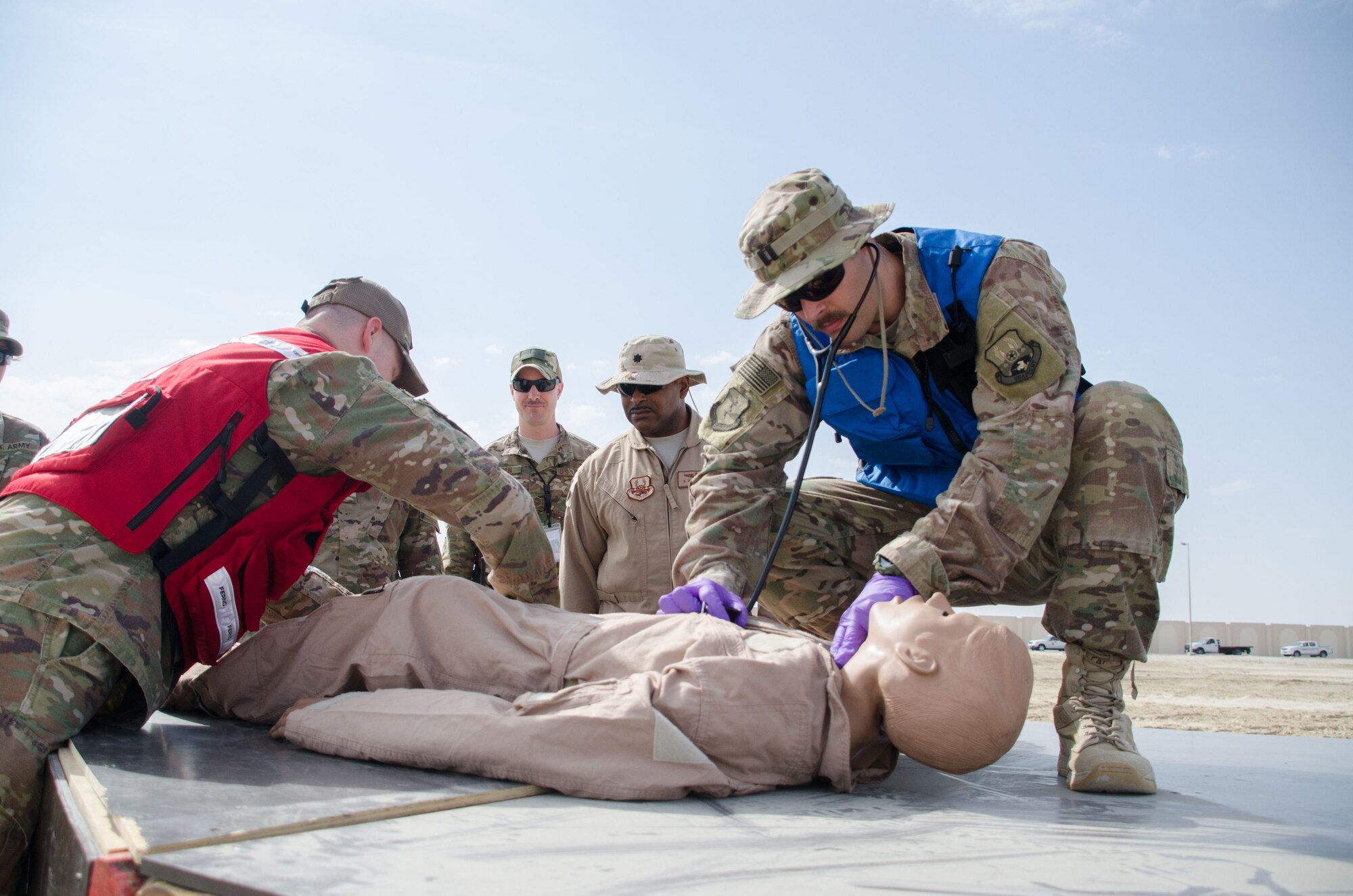 Members from the 380th Expeditionary Medical Squadron, responds to an F-22 Raptor crash during the Major Accident Response Exercise at Al Dhafra Air Base, United Arab Emirates Dec 15, 2017. Medical personnel were evaluated on protocol procedures involving injured, wounded and deceased service members. (U.S. Air National Guard Photo by Staff Sgt. Colton Elliott)
