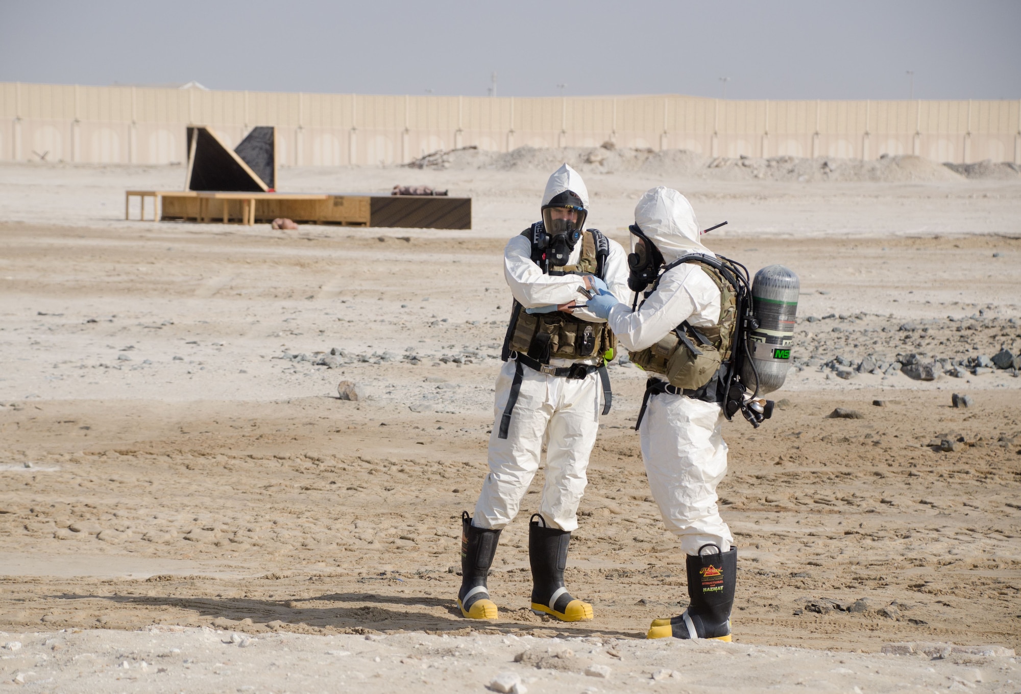 The 380th Expeditionary Civil Engineering Squadron, explosive ordnance disposal technicians, participates in a base-wide Major Accident Response Exercise to test and evaluate their procedures as first responders at Al Dhafra Air Base, United Arab Emirates Dec. 15, 2017. The MARE involved an F-22 Raptor crashing on base; resulting in five injuries and three fatalities. (U.S. Air National Guard Photo by Staff Sgt. Colton Elliott)